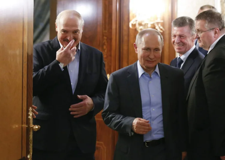Russian President Vladimir Putin (C) and Belarusian President Alexander Lukashenko (L) walk during their meeting in the Black sea resort of Sochi, on February 7, 2020. (Photo by Alexander Zemlianichenko / POOL / AFP)