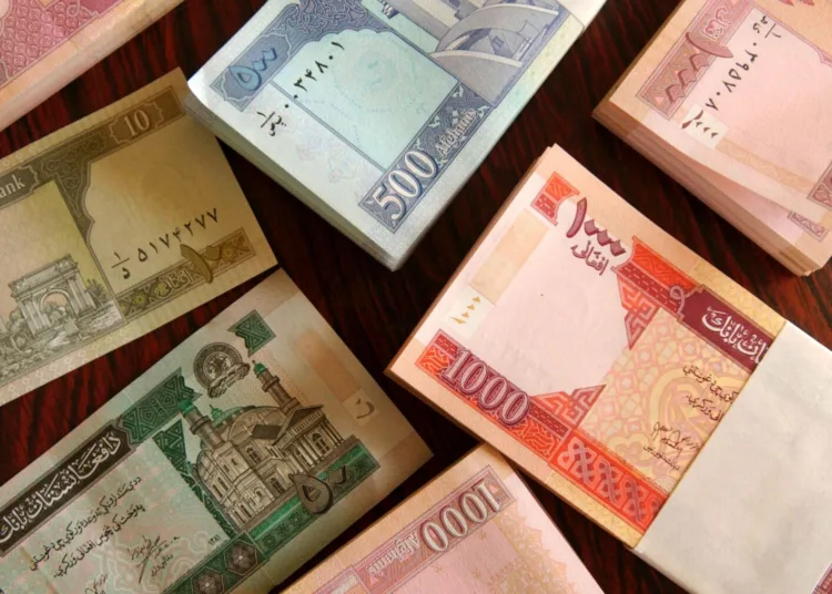 KABUL, AFGHANISTAN - OCTOBER 9: Neat piles of the new Afghan currency are shown at the Central Bank October 9, 2002 in Kabul, Afghanistan. Afghanistan introduced a new currency on Monday, sending hoardes of Afghans to the money exchanges to turn in the old currency for the new one. The old Afghan money's highest denomination of 10,000 Afghanis was worth about a quarter in U.S. dollars, necessitating huge stacks of cash for most transactions. The old currency, once turned in, is destroyed. The new currency is critical for the government to take control over Afghanistan's chaotic monetary policy, which up to now included money printed by regional warlords. (Photo by Chris Hondros/Getty Images)