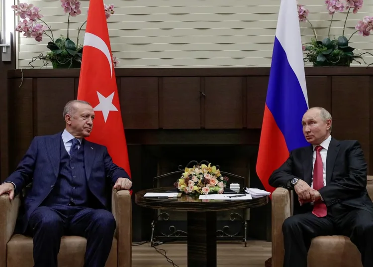 Russian President Vladimir Putin, right, and Turkish President Recep Tayyip Erdogan talk to each other during their meeting in the Bocharov Ruchei residence in the Black Sea resort of Sochi, Russia, Wednesday, Sept. 29, 2021. (Vladimir Smirnov, Sputnik, Kremlin Pool Photo via AP)