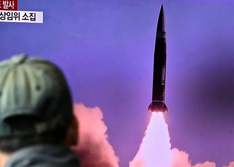 A man watches a television report showing a news broadcast with file footage of a North Korean missile test, at a railway station in Seoul on October 19, 2021, after the South's military said a North Korean weapons test was believed to be a submarine-launched ballistic missile. (Photo by Anthony WALLACE / AFP) (Photo by ANTHONY WALLACE/AFP via Getty Images)