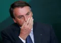FILE PHOTO: Brazil's President Jair Bolsonaro reacts during the launching ceremony of the National Green Growth Program, at the Planalto Palace in Brasilia, Brazil October 25, 2021. REUTERS/Adriano Machado/File Photo