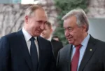 United Nations Secretary-General Antonio Guterres welcomes Russian President Vladimir Putin at the Libya summit in Berlin, Germany, January 19, 2020. REUTERS/Axel Schmidt