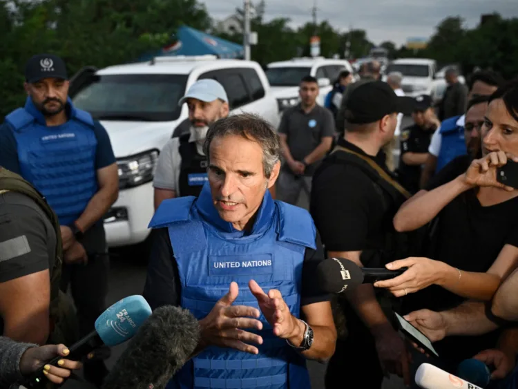 International Atomic Energy Agency (IAEA) chief Rafael Grossi talks to the press on a road outside Zaporizhzhia city, after his visit to the Russian-held Zaporizhzhia nuclear power plant in southern Ukraine on September 1, 2022, amid the Russian invasion of Ukraine. - The head of the UN nuclear agency on September 1, 2022 said the "physical integrity" of a Russian-held Ukrainian nuclear plant had been "violated" following frequent shelling, on his team's first visit to the facility. (Photo by Genya SAVILOV / AFP) (Photo by GENYA SAVILOV/AFP via Getty Images)