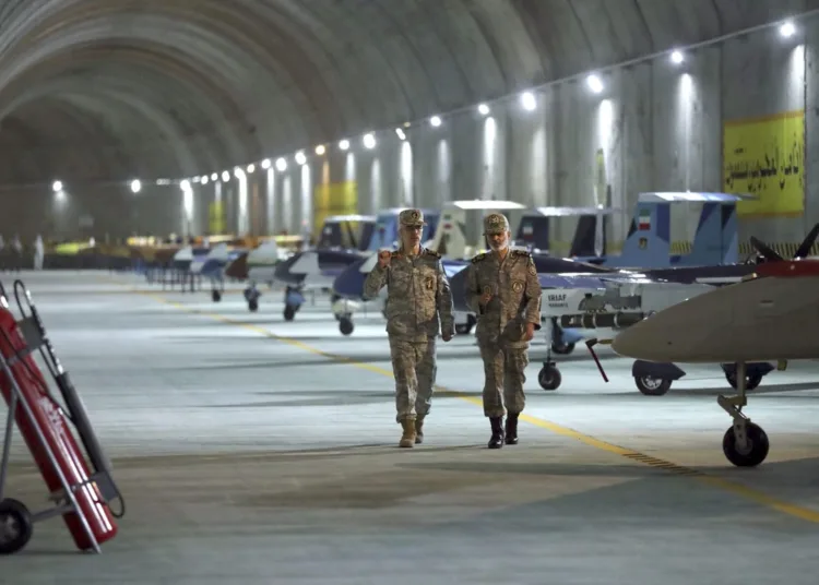 Chief of the General Staff of the Armed Forces Gen. Mohammad Hossein Bagheri, left, and Commander of the Army Gen. Abdolrahim Mousavi visit an underground drone base tunnel in the western Zagros Mountains.