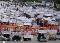 South Korean fishermen stage a rally against Japanese government's decision to release treated radioactive water from Fukushima nuclear power plant, in front of the National Assembly in Seoul, South Korea, Monday, June 12, 2023. (AP Photo/Ahn Young-joon)