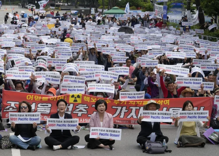 South Korean fishermen stage a rally against Japanese government's decision to release treated radioactive water from Fukushima nuclear power plant, in front of the National Assembly in Seoul, South Korea, Monday, June 12, 2023. (AP Photo/Ahn Young-joon)