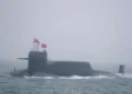 A new type 094A Jin-class nuclear submarine Long March 10 of the Chinese People's Liberation Army (PLA) Navy participates in a naval parade to commemorate the 70th anniversary of the founding of China's PLA Navy in the sea near Qingdao, in eastern China's Shandong province on April 23, 2019. - China celebrated the 70th anniversary of its navy by showing off its growing fleet in a sea parade featuring a brand new guided-missile destroyer. (Photo by Mark Schiefelbein / POOL / AFP) (Photo credit should read MARK SCHIEFELBEIN/AFP via Getty Images)
