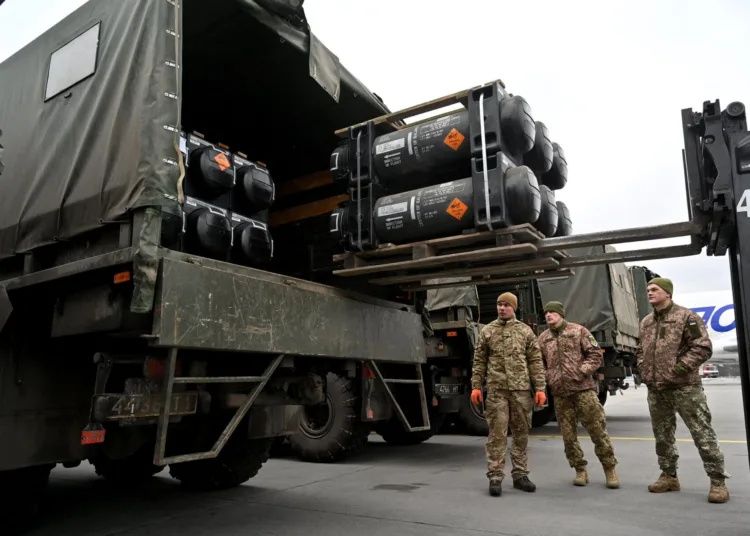 Ukrainian servicemen load a truck with the FGM-148 Javelin, American man-portable anti-tank missile provided by US to Ukraine as part of a military support, upon its delivery at Kyiv's airport Boryspil on February 11,2022, amid the crisis linked with the threat of Russia's invasion. (Photo by Sergei SUPINSKY / AFP) (Photo by SERGEI SUPINSKY/AFP via Getty Images)