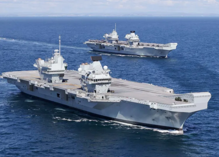 HMS Prince of Wales and HMS Queen Elizabeth pictured at sea for the first time.
Wednesday 19 May 2021 saw a historic moment in Britain’s carrier renaissance as HMS Queen Elizabeth and HMS Prince of Wales met at sea for the first time. With two 65,000 tonne carriers in operational service, Britain has a continuous carrier strike capability, with one vessel always ready to respond to global events at short notice.