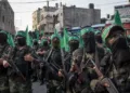 GAZA CITY, GAZA - JULY 20: Palestinian Hamas militants are seen during a military show in the Bani Suheila district on July 20, 2017 in Gaza City, Gaza. For the past ten years Gaza residents have lived with constant power shortages, in recent years these cuts have worsened, with supply of regular power limited to four hours a day. On June 11, 2017 Israel announced a new round of cuts at the request of the Palestinian authorities and the decision was seen as an attempt by President Mahmoud Abbas to pressure Gaza's Hamas leadership. Prior to the new cuts Gaza received 150 megawatts per day, far below it's requirements of 450 megawatts. In April, Gaza's sole power station which supplied 60 megawatts shut down, after running out of fuel, the three lines from Egypt, which provided 27 megawatts are rarely operational, leaving Gaza reliant on the 125 megawatts supplied by Israel's power plant. The new cuts now restrict electricity to three hours a day severely effecting hospital patients with chronic conditions and babies on life support. During blackout hours residents use private generators, solar panels and battery operated light sources to live. June 2017 also marked ten years since Israel began a land, sea and air blockade over Gaza. Under the blockade, movement of people and goods is restricted and exports and imports of raw materials have been banned. The restrictions have virtually cut off access for Gaza's two million residents to the outside world and unemployment rates have skyrocketed forcing many people into poverty and leaving approximately 80% of the population dependent on humanitarian aid. (Photo by Chris McGrath/Getty Images)