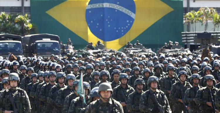 The Brazilian Army Command presents the military contingent that will work on the security of the 2013 FIFA Confederations Cup in Brasilia on June 13, 2013. The security forces will be formed personnel from the Army and the Paramilitary Police. AFP PHOTO/Beto BARATA. (Photo credit should read BETO BARATA/AFP/Getty Images)