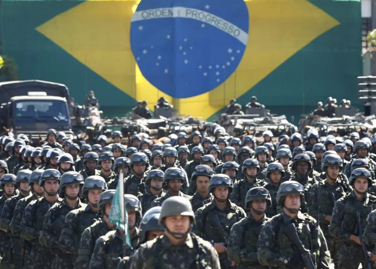 The Brazilian Army Command presents the military contingent that will work on the security of the 2013 FIFA Confederations Cup in Brasilia on June 13, 2013. The security forces will be formed personnel from the Army and the Paramilitary Police. AFP PHOTO/Beto BARATA. (Photo credit should read BETO BARATA/AFP/Getty Images)