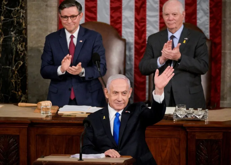 U.S. House Speaker Mike Johnson (R-LA) and Senate Foreign Relations Chair, Senator Ben Cardin (D-MD), applaud as Israeli Prime Minister Benjamin Netanyahu addresses a joint meeting of Congress at the U.S. Capitol in Washington, U.S., July 24, 2024. REUTERS/Craig Hudson