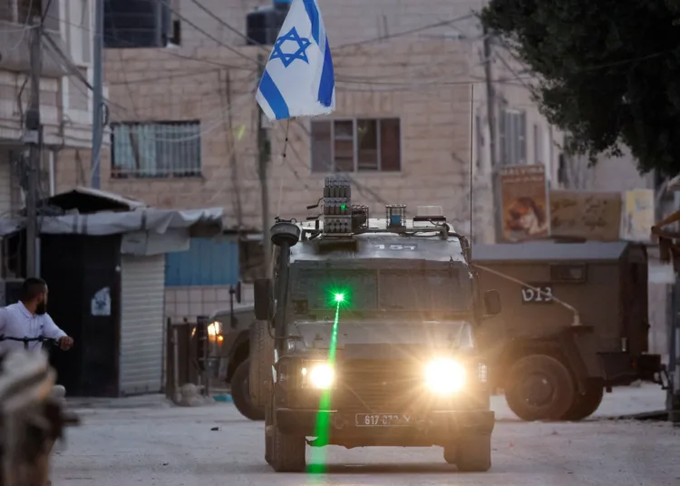 A military vehicle with a laser transits during an Israeli raid in Jenin, in the Israeli-occupied West Bank, September 25, 2024. REUTERS/Raneen Sawafta/File Photo