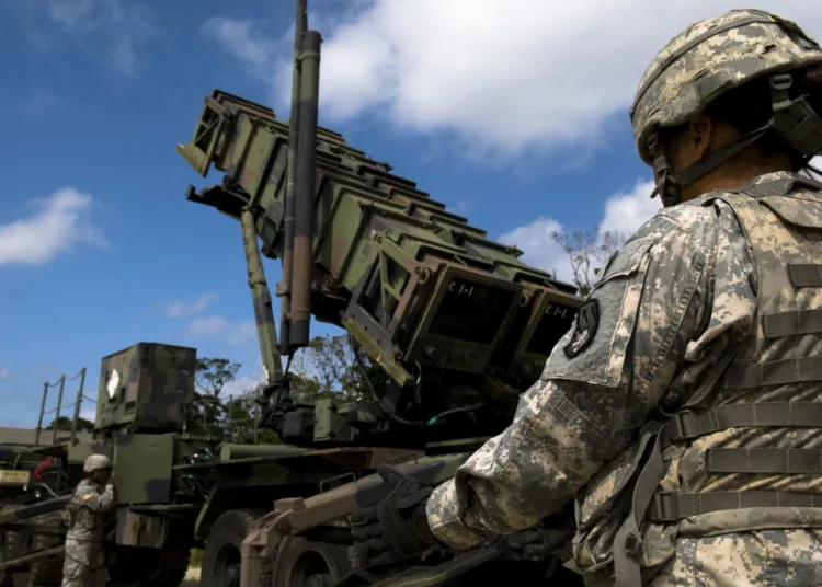 U.S. Army Privates 1st Class Danica Sasakura and Dean Werner, 1-1 Air Defense Artillery, Charley Battery Patriot Missile operators, perform pre-launch checks on a Patriot missile launcher as part of a field training exercise on Kadena Air Base, Japan, Oct. 26. Kadena hosts the largest combat wing in the Pacific and includes U.S. Air Force, Army, Navy and Marine Corps assets.