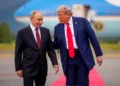 ANCHORAGE, ALASKA - AUGUST 15: (EDITOR'S NOTE: Alternate Crop) U.S. President Donald Trump (R) greets Russian President Vladimir Putin as he arrives at Joint Base Elmendorf-Richardson on August 15, 2025 in Anchorage, Alaska. The two leaders are meeting for peace talks aimed at ending the war in Ukraine. (Photo by Andrew Harnik/Getty Images)