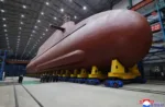 North Korea's leader Kim Jong Un inspected the country's nuclear-powered submarine, claimed to be 8,700 ton, as he called Seoul's nuclear-powered submarine development plan "an offensive act" KCNA