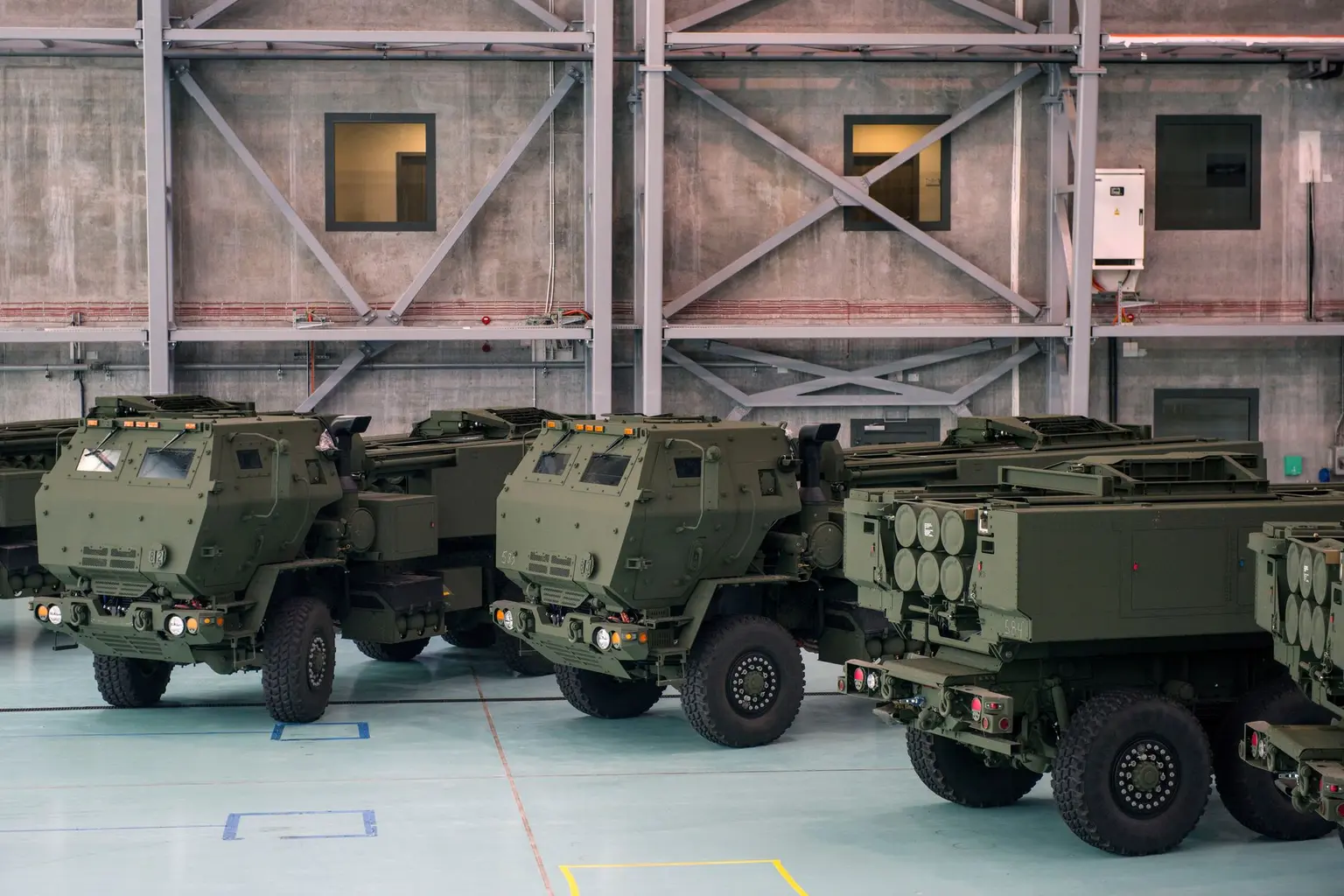 HIMARS rocket launchers are seen placed on military vehicles at the military 1st Transport Aviation Base in Warsaw on May 15, 2023 in Warsaw (Attila Husejnow/SOPA Images/LightRocket via Getty Images).