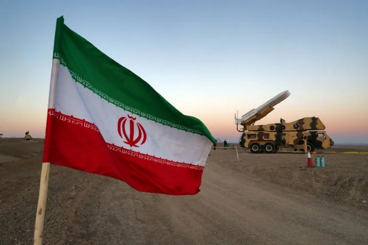 FILE PHOTO: An Iranian flag is pictured near in a missile during a military drill, with the participation of Iran’s Air Defense units, Iran October 19, 2020. Picture taken October 19, 2020. WANA (West Asia News Agency) via REUTERS