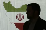 Stuart Davis, a director at one of FireEye's subsidiaries, stands in front of a map of Iran as he speaks to journalists about the techniques of Iranian hacking, Wednesday, Sept. 20, 2017, in Dubai, United Arab Emirates. A new report by FireEye, a cybersecurity firm, warned that a suspected group of hackers in Iran are targeting the aviation and petrochemical industries in Saudi Arabia, the U.S. and South Korea. (AP Photo/Kamran Jebreili)