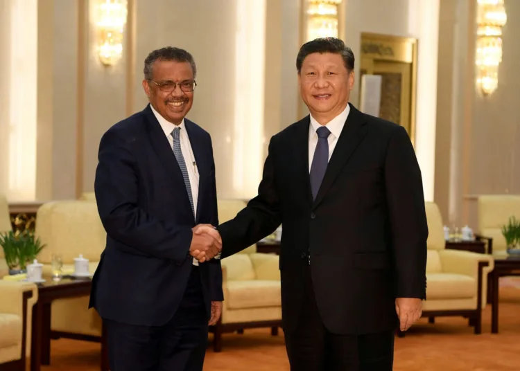 FILE PHOTO: Tedros Adhanom, director general of the World Health Organization, shakes hands with Chinese President Xi jinping before a meeting at the Great Hall of the People in Beijing, China, January 28, 2020. To match Special Report HEALTH-CORONAVIRUS/WHO-TEDROS Naohiko Hatta/Pool via REUTERS/File Photo
