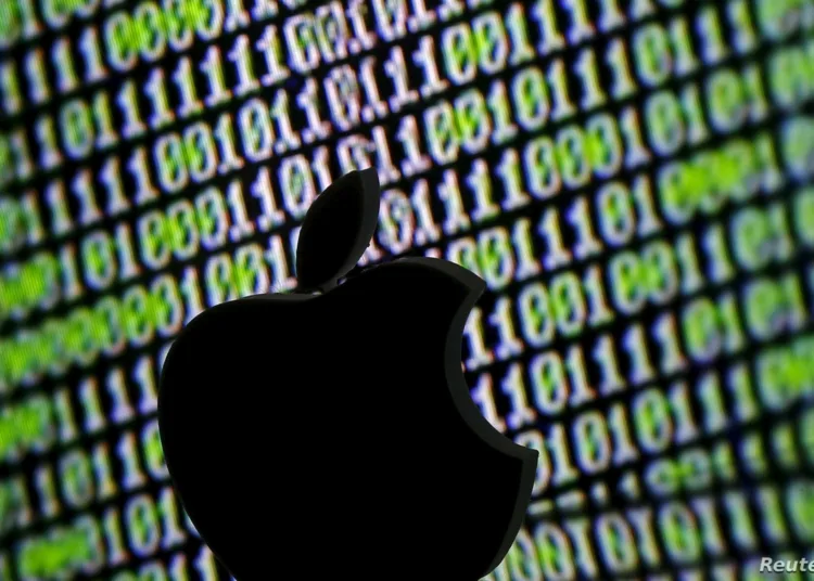 A 3D printed Apple logo is seen in front of a displayed cyber code in this illustration taken March 22, 2016. REUTERS/Dado Ruvic/Illustration - RTSBS6Q