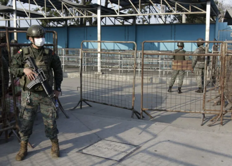 Soldiers guard the entrance to the Litoral Penitentiary a day after a deadly riot, in Guayaquil, Ecuador, Wednesday, September 29, 2021. The authorities report at least 100 dead and 52 injured in a riot on Tuesday in the prison. (AP Photo / Angel DeJesus)