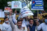 India's Congress party workers carrying banners and placards shout slogans as they take part in a demonstration against the Bharatiya Janata Party (BJP)led government and  Indian Prime Minister Narendra Modi against alleged surveillance operation using the Pegasus spyware, in New Delhi on July 20, 2021. (Photo by Prakash SINGH / AFP) (Photo by PRAKASH SINGH/AFP via Getty Images)