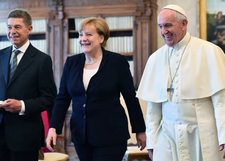 Pope Francis smiles with German Chancellor Angela Merkel and her husband Joachim Sauer, left, on the occasion of their private audience, at the Vatican, Saturday, June 17, 2017. (Ettore Ferrari/Pool Photo via AP)