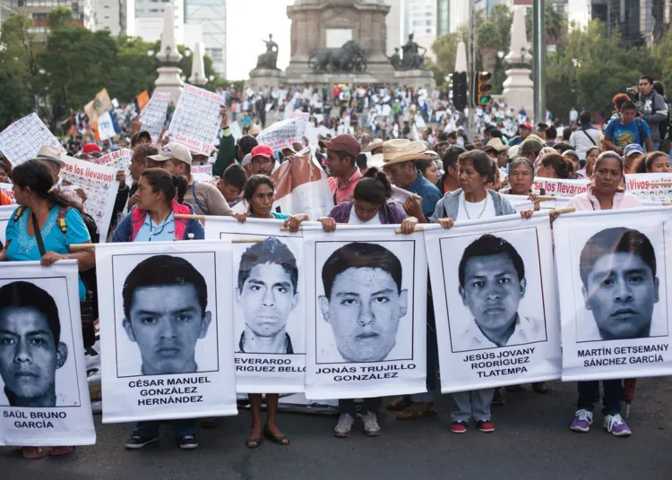 Parents of missing students lead a march through Mexico City during the 'Global Day of Action for Ayotzinapa' Wednesday, October 23, 2014.

The march was held to demand answers following the killing of three students and the disappearance of 43 more in the city of  Ayotzinapa, Guerrero, which is South West of Mexico City.  The students have been missing since September 26, 2014 and the local mayor and his wife are accused of ordering the kidnappings and killings. The local police are also accused of working with  the Guerreros Unidos cartel in the crimes. 

Since September 26, many mass graves have been located in the area surrounding the city, yet none of the remains found match the students. 

Colleges and Universities all across Mexico declared a strike for September 22 and 23, 2014 and protests in support of the missing students were held all over the world. 

(Brett Gundlock/Boreal Collective)