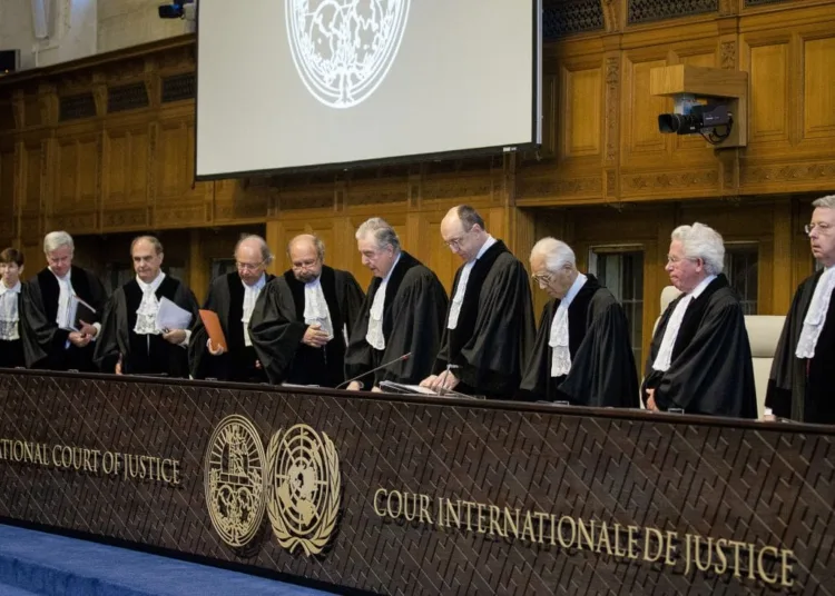 Judges of the International Court of Justice arrive in the courtroom during the first day of the witnesses in the Croatia vs. Serbia case in the Peace Palace in The Hague, The Netherlands, on March 2014. Croatia accuses neighbouring country Serbia of committing genocide in the nineties at the breakup of Yugoslavia. AFP PHOTO/ANP BART MAAT netherlands out (Photo credit should read BART MAAT/AFP/Getty Images)