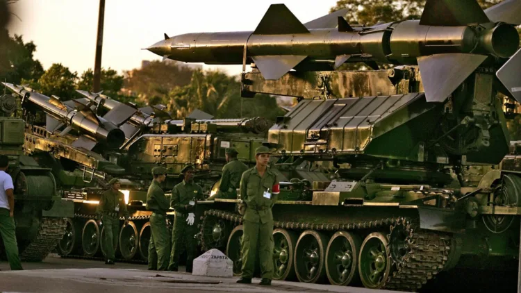 HAVANA, CUBA:  Russian-made SAM-6 antiaircraft missiles remain iddle early morning  29 November, 2006 at Revolution Square in Havana awaiting to take part in a drill. On December 2nd the Cuban Army will parade at the Revolution Square to celebrate the 80th anniversary of President Fidel Castro and the 50th of the arrival of the Granma boat in Cuba and the creation of the Cuban army (Fuerzas Armadas Revolucionarias).           AFP PHOTO/ADALBERTO ROQUE  (Photo credit should read ADALBERTO ROQUE/AFP/Getty Images)