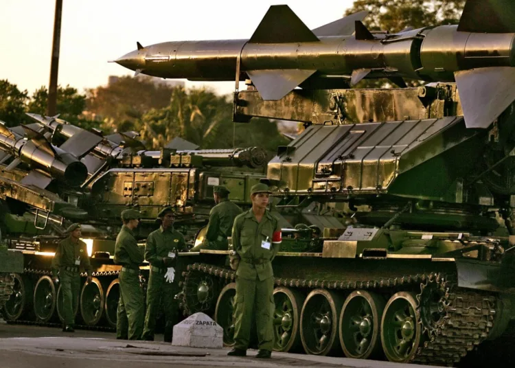 HAVANA, CUBA:  Russian-made SAM-6 antiaircraft missiles remain iddle early morning  29 November, 2006 at Revolution Square in Havana awaiting to take part in a drill. On December 2nd the Cuban Army will parade at the Revolution Square to celebrate the 80th anniversary of President Fidel Castro and the 50th of the arrival of the Granma boat in Cuba and the creation of the Cuban army (Fuerzas Armadas Revolucionarias).           AFP PHOTO/ADALBERTO ROQUE  (Photo credit should read ADALBERTO ROQUE/AFP/Getty Images)
