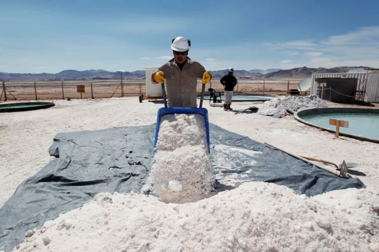 FILE PHOTO: Braulio Lopez of Galaxy Resources lithium mining division carts halite concentrate at the Salar del Hombre Muerto, or Dead Man's Salt Flat, an important source of lithium at around 4,000 meters (13,123 feet) above sea level on the border of the northern Argentine provinces of Catamarca and Salta, October 28, 2012. REUTERS/Enrique Marcarian/File Photo