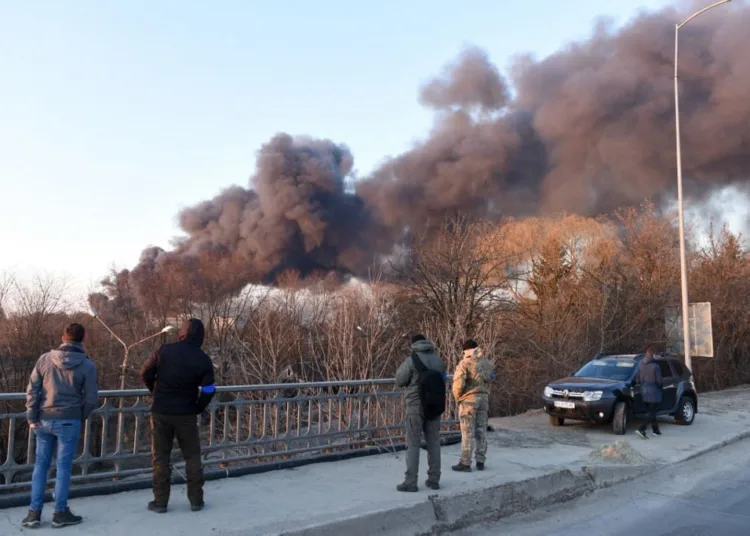 Smoke rises after an explosion in the western Ukrainian city of Lviv on March 18, 2022. - Russian forces on March 18 destroyed an aircraft repair plant in the western Ukrainian city of Lviv but no one was hurt, the mayor said. Lviv is the largest city in western Ukraine and a popular tourist destination known for its picturesque views. Last weekend Russian cruise missiles devastated a military base west of Lviv, killing 35 people and wounding more than 130. Located 70 kilometres (45 miles) from the border with EU member Poland, the city had largely been spared since Russian forces invaded on February 24. (Photo by Yuriy Dyachyshyn / AFP)