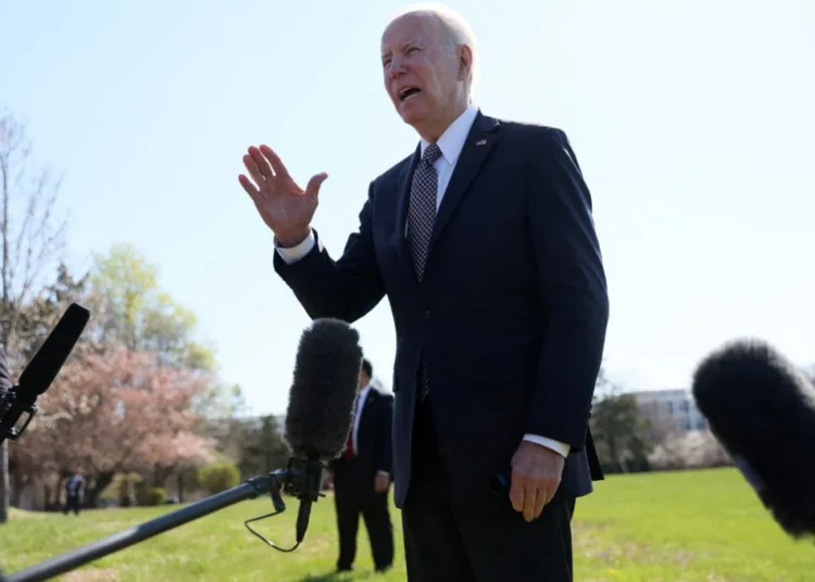 U.S. President Joe Biden calls Russia's President Vladimir Putin a war criminal and said he would call for a war crimes trial, as he speaks to reporters upon arriving at Fort Mcnair Army Base in Washington, U.S., April 4, 2022. REUTERS/Leah Millis