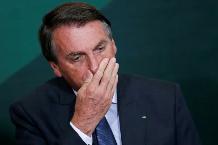 FILE PHOTO: Brazil's President Jair Bolsonaro reacts during the launching ceremony of the National Green Growth Program, at the Planalto Palace in Brasilia, Brazil October 25, 2021. REUTERS/Adriano Machado/File Photo