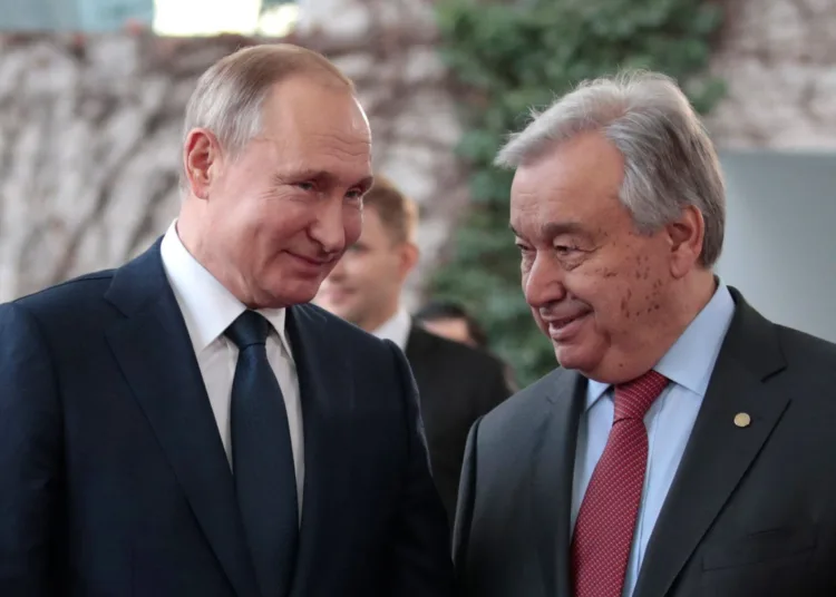 United Nations Secretary-General Antonio Guterres welcomes Russian President Vladimir Putin at the Libya summit in Berlin, Germany, January 19, 2020. REUTERS/Axel Schmidt