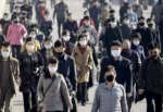 FILE PHOTO: People wearing protective face masks commute amid concerns over the new coronavirus disease (COVID-19) in Pyongyang, North Korea March 30, 2020, in this photo released by Kyodo.  Mandatory credit Kyodo/via REUTERS