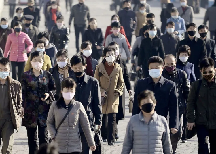 FILE PHOTO: People wearing protective face masks commute amid concerns over the new coronavirus disease (COVID-19) in Pyongyang, North Korea March 30, 2020, in this photo released by Kyodo. Mandatory credit Kyodo/via REUTERS