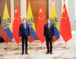 Ecuador's President Guillermo Lasso and China's Premier Li Keqiang pose for a photograph, in Beijing, China February 5, 2022. Picture taken February 5, 2022. Ecuador Presidency/Handout via REUTERS ATTENTION EDITORS - THIS IMAGE HAS BEEN SUPPLIED BY A THIRD PARTY. NO RESALES. NO ARCHIVES