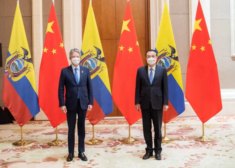 Ecuador's President Guillermo Lasso and China's Premier Li Keqiang pose for a photograph, in Beijing, China February 5, 2022. Picture taken February 5, 2022. Ecuador Presidency/Handout via REUTERS ATTENTION EDITORS - THIS IMAGE HAS BEEN SUPPLIED BY A THIRD PARTY. NO RESALES. NO ARCHIVES