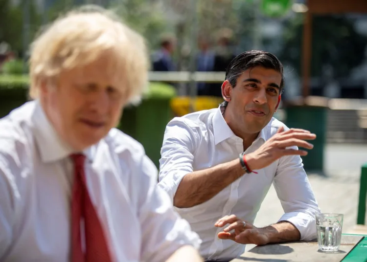 Britain's Prime Minister Boris Johnson and Chancellor Rishi Sunak visit Pizza Pilgrims in West India Quay, in London, Britian June 26, 2020. Heathcliff O'Malley/Pool via REUTERS