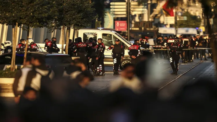 Security and ambulances at the scene after an explosion on Istanbul's popular pedestrian Istiklal Avenue, Sunday, Nov. 13, 2022. An explosion on one of Istanbul's most popular pedestrian thoroughfares killed four people and injured 38 on Sunday, authorities said. The cause of the blast on Istiklal Avenue was not immediately clear. Five prosecutors were assigned to investigate the explosion, state-run Anadolu news agency said.(AP Photo/Emrah Gurel)
