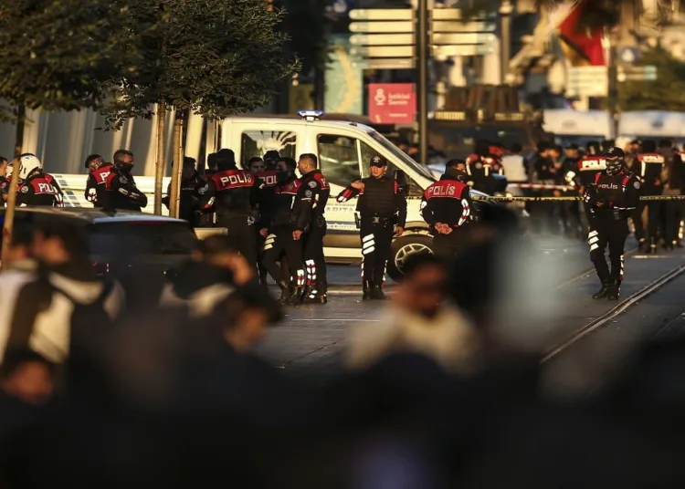 Security and ambulances at the scene after an explosion on Istanbul's popular pedestrian Istiklal Avenue, Sunday, Nov. 13, 2022. An explosion on one of Istanbul's most popular pedestrian thoroughfares killed four people and injured 38 on Sunday, authorities said. The cause of the blast on Istiklal Avenue was not immediately clear. Five prosecutors were assigned to investigate the explosion, state-run Anadolu news agency said.(AP Photo/Emrah Gurel)