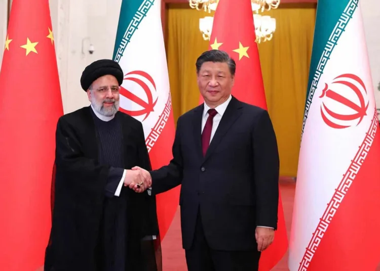This handout picture provided by the Iranian presidency shows Chinese President Xi Jinping welcoming the Islamic Republic's President Ebrahim Raisi (L) during his visit in Beijing on February 14, 2023. (Photo by Iranian Presidency / AFP) / === RESTRICTED TO EDITORIAL USE - MANDATORY CREDIT "AFP PHOTO / HO / IRANIAN PRESIDENCY" - NO MARKETING NO ADVERTISING CAMPAIGNS - DISTRIBUTED AS A SERVICE TO CLIENTS ===