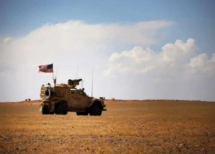 Green Berets wait in a M-ATV Special Forces Vehicle for a gun truck from the Maghaweir al-Thowra (MaT) partner force to join their joint patrol mission near At-Tanf Garrison, Syria, April 29, 2020. Coalition forces train and advise the MaT in southern Syria in pursuit of the enduring defeat of Daesh and to set conditions for regional stability. (U.S. Army photo by Staff Sgt. William Howard)