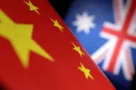 Printed Chinese and Australian flags are seen in this illustration, July 21, 2022. REUTERS/Dado Ruvic/Illustration/Files
