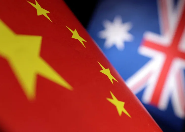 Printed Chinese and Australian flags are seen in this illustration, July 21, 2022. REUTERS/Dado Ruvic/Illustration/Files
