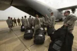 U.S. Army Soldiers with Combined Joint Task Force-Horn of Africa's East Africa Response Force (EARF), load onto a U.S. Air Force C-130J Hercules to redeploy to Djibouti after being relieved by other members of their team in Juba, South Sudan, Jan. 22, 2014. The EARF has been positioned at the U.S. Embassy in Juba, South Sudan since Dec. 18, 2013, when the initial evacuation of U.S. citizens took place. The EARF is part of a Defense Department initiative of regionally aligned forces, which provides the commander of the U.S. Africa Command an additional capability to respond to crises and contingencies within East Africa. (U.S. Air Force photo by Staff Sgt. Staci Miller/RELEASED)